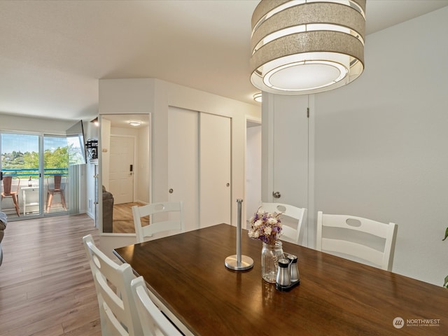 dining area featuring light wood-type flooring