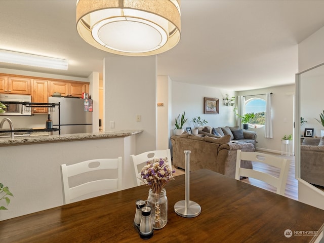 dining room with hardwood / wood-style flooring