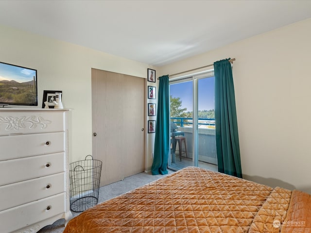 carpeted bedroom featuring access to outside