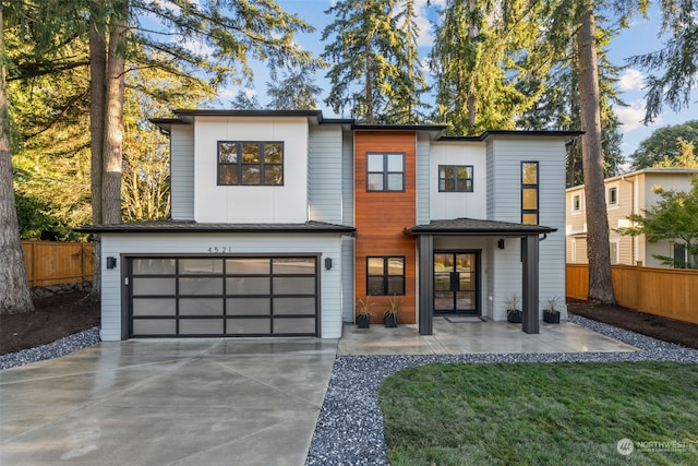 modern home with a garage and a front yard