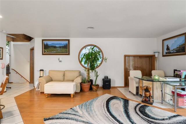 living room featuring plenty of natural light and light tile patterned flooring