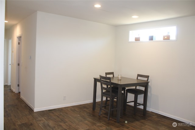 dining area featuring dark hardwood / wood-style floors