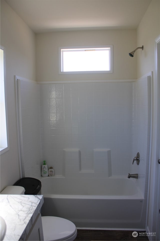 full bathroom featuring vanity, toilet, and shower / washtub combination