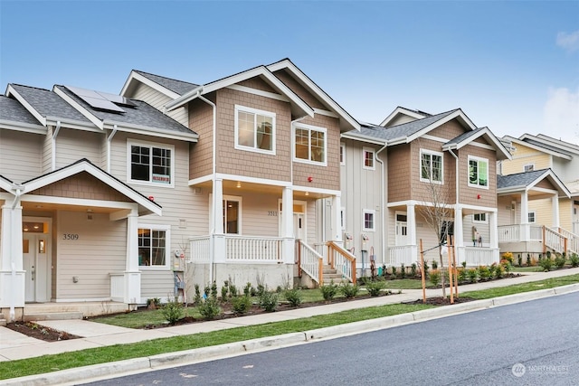 view of front of house featuring solar panels