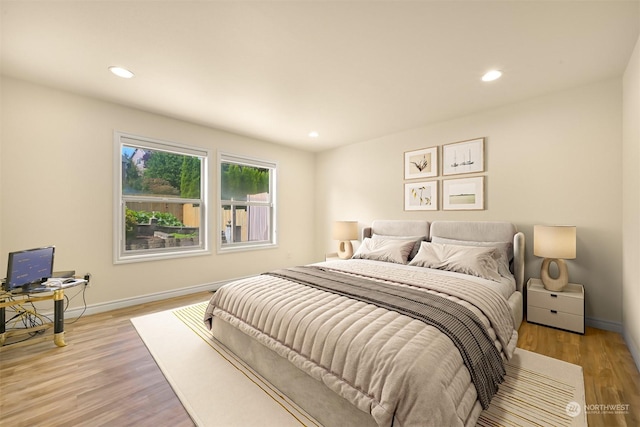 bedroom featuring recessed lighting, baseboards, and light wood finished floors