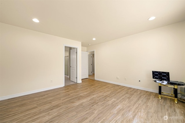 interior space with light wood finished floors, recessed lighting, and baseboards