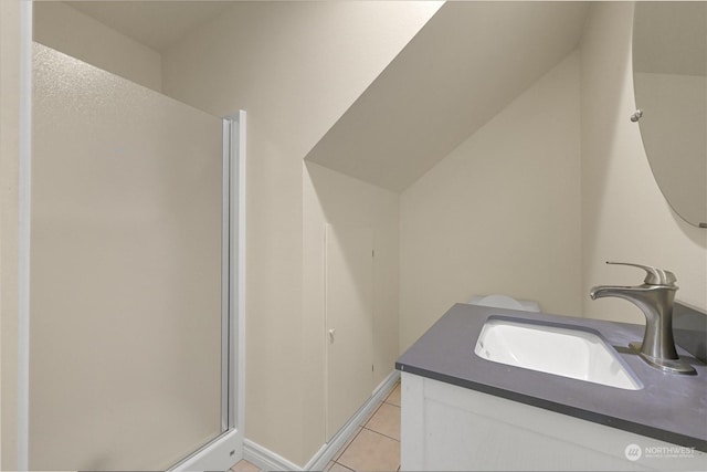 full bath featuring a shower stall, vanity, and tile patterned floors