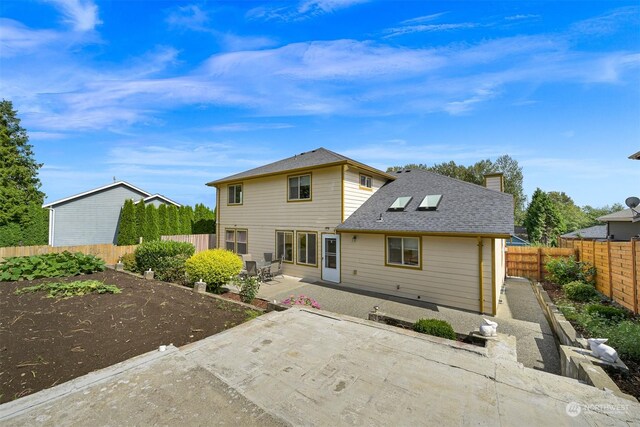 back of house featuring a patio area