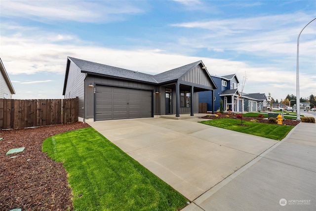 view of front facade with a garage and a front yard