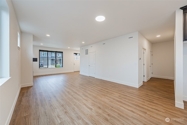 unfurnished living room with light wood-type flooring