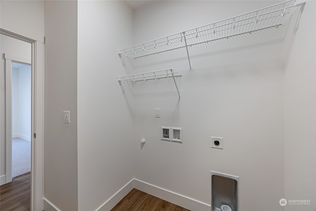 washroom with hookup for an electric dryer, washer hookup, dark hardwood / wood-style floors, and hookup for a gas dryer