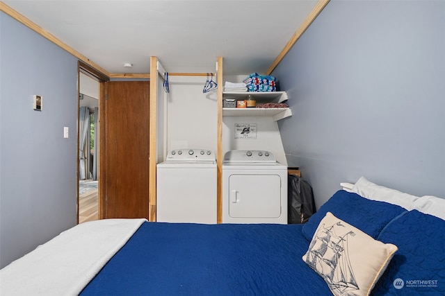 bedroom with washing machine and dryer