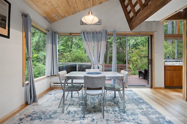 dining space with wooden ceiling, light wood-style floors, baseboards, and vaulted ceiling