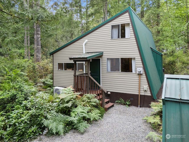 view of front of property featuring metal roof