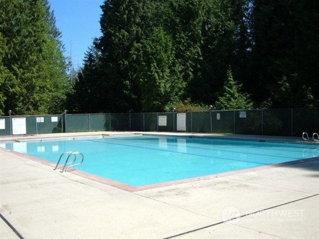 community pool featuring fence