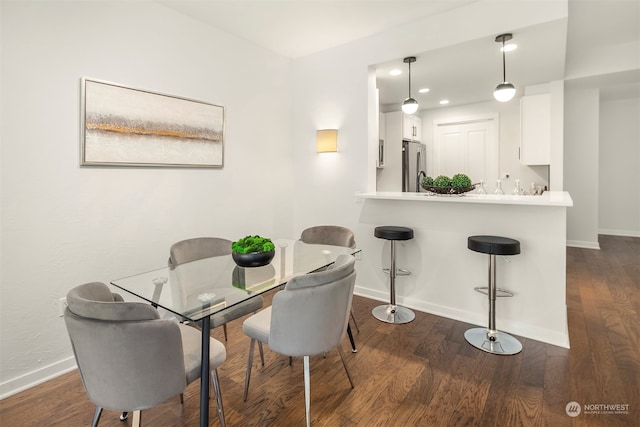 dining room with dark wood-type flooring