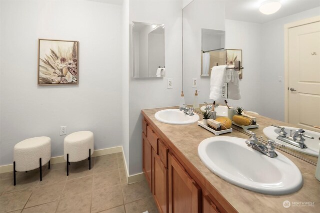 bathroom with vanity and tile patterned flooring