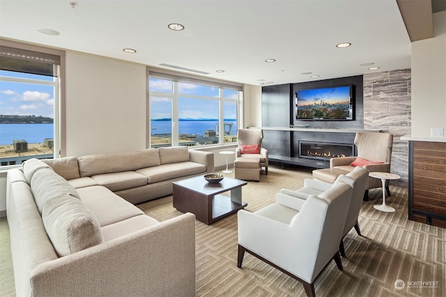 living room with a wealth of natural light and carpet floors