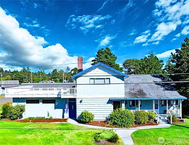 4514 L Pl, Seaview, WA 98644 - view of front of home with a front lawn, a porch, and a chimney