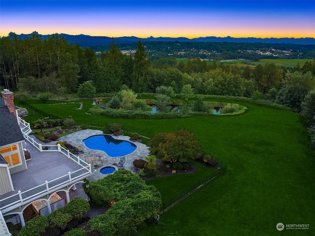 birds eye view of property with a mountain view