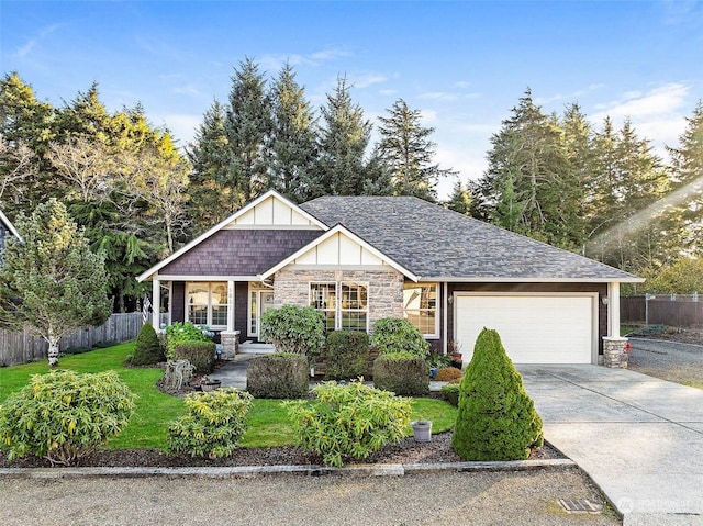 1001 Lakeview Dr, Ilwaco, WA 98624 - view of front of property featuring stone siding, an attached garage, driveway, and roof with shingles