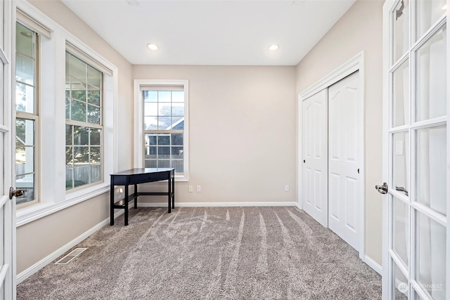 1001 Lakeview Dr, Ilwaco, WA 98624 - unfurnished bedroom featuring carpet, a closet, and recessed lighting