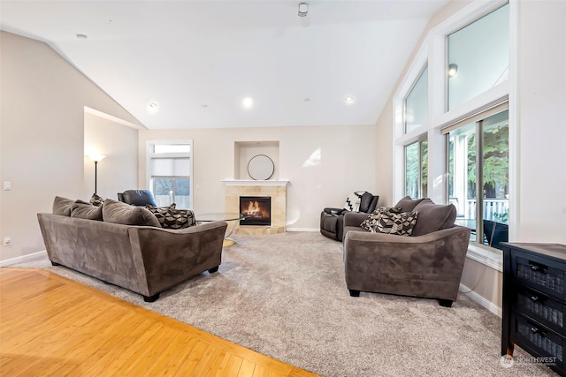 1001 Lakeview Dr, Ilwaco, WA 98624 - carpeted living room with healthy amount of natural light, a premium fireplace, high vaulted ceiling, recessed lighting, and wood finished floors
