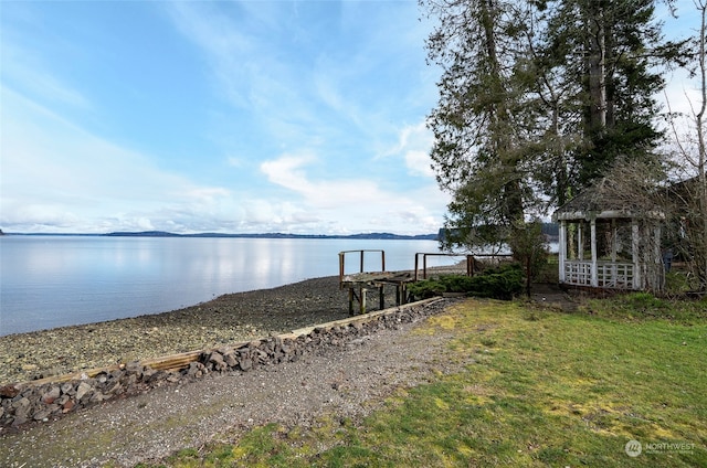 dock area with a water view and a gazebo