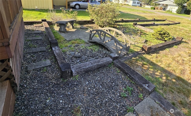 view of yard featuring a vegetable garden and fence