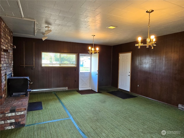 interior space with wood walls and a notable chandelier