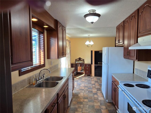 kitchen with a textured ceiling, an inviting chandelier, pendant lighting, white electric range, and sink