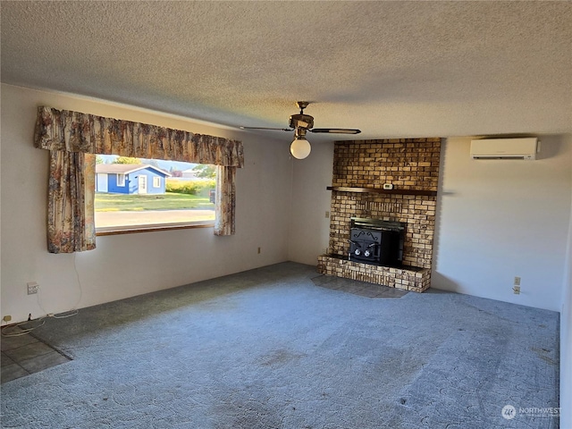 unfurnished living room featuring carpet floors, a ceiling fan, an AC wall unit, a wood stove, and a textured ceiling