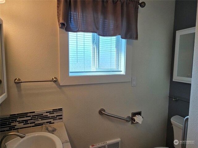 bathroom with toilet and sink