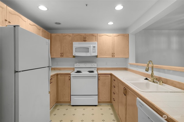 kitchen with tile countertops, white appliances, sink, and light brown cabinetry