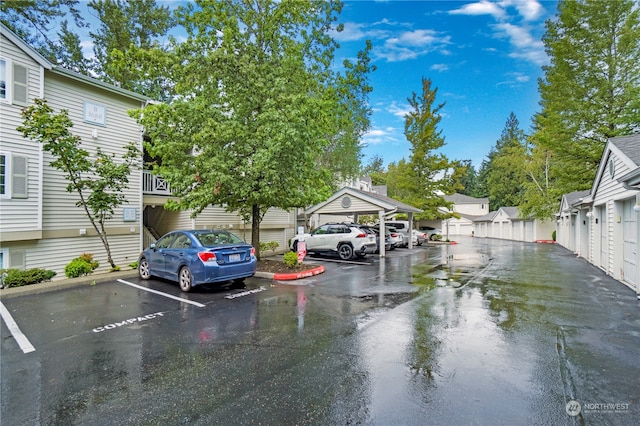 view of vehicle parking featuring a carport