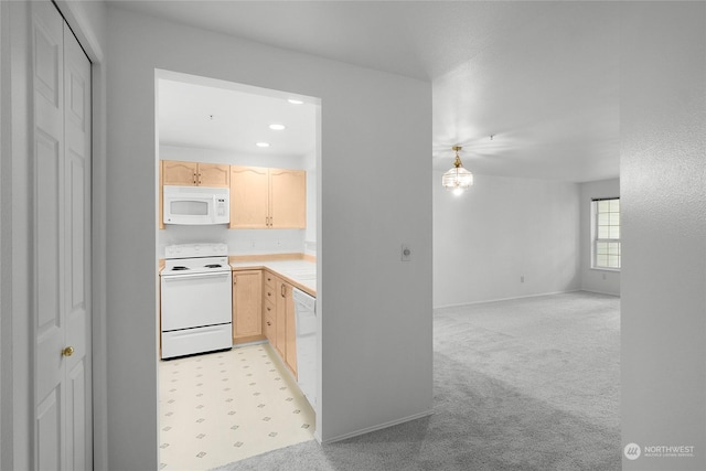 kitchen featuring open floor plan, light countertops, white appliances, light brown cabinetry, and light colored carpet