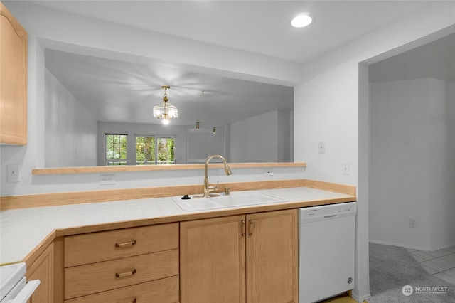 kitchen with tile countertops, light brown cabinets, white appliances, and sink