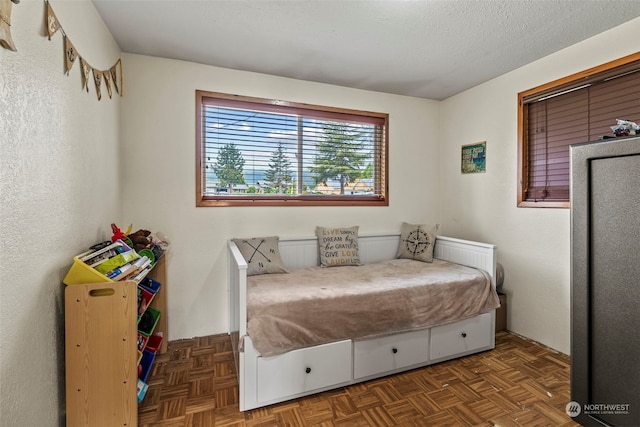 bedroom featuring a textured ceiling