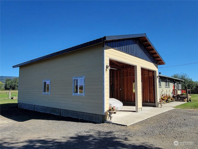 view of home's exterior with a garage and board and batten siding