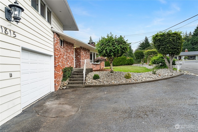 view of patio / terrace with a garage