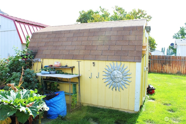 view of outdoor structure with a lawn