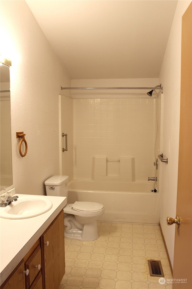 full bathroom featuring vanity, bathtub / shower combination, and toilet