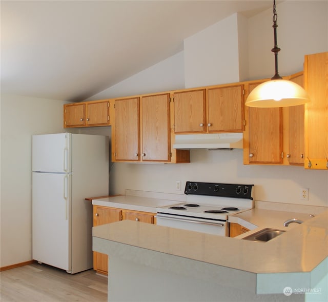 kitchen featuring hanging light fixtures, sink, white appliances, light hardwood / wood-style flooring, and vaulted ceiling