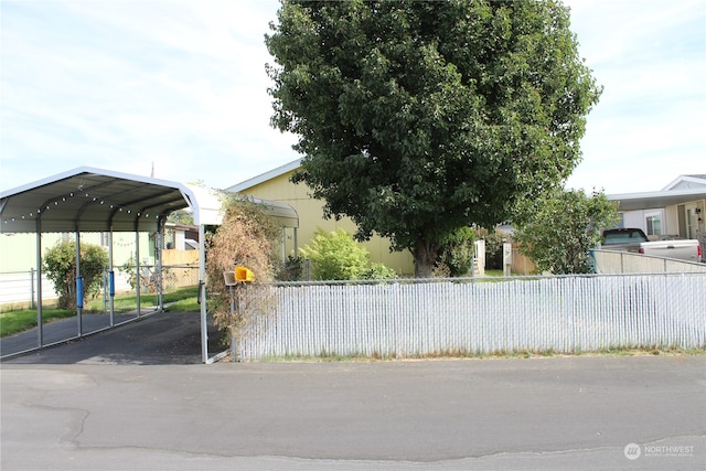 view of property exterior featuring a carport