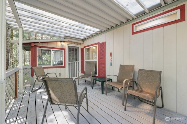 sunroom featuring lofted ceiling