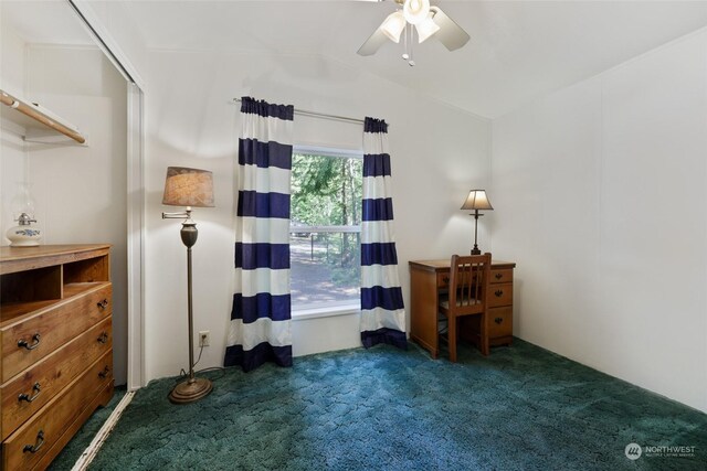 bedroom with dark carpet, a closet, ceiling fan, and vaulted ceiling