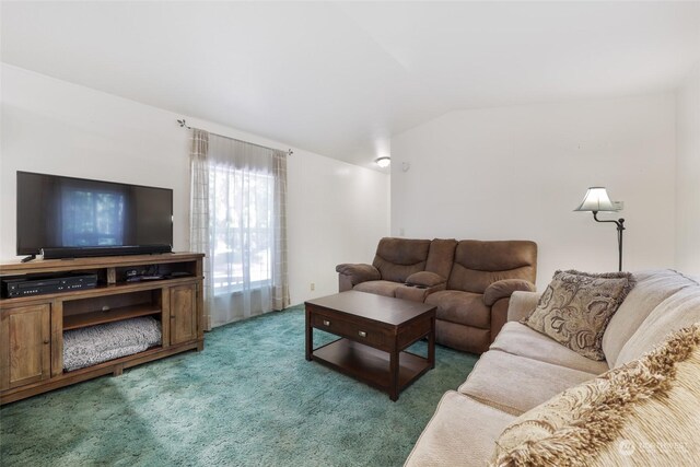 living room with lofted ceiling and dark carpet