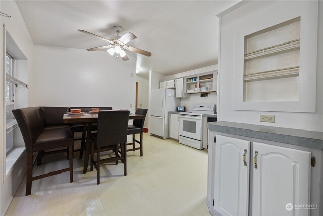 dining space featuring ceiling fan