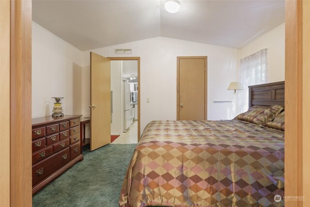 carpeted bedroom with visible vents and vaulted ceiling