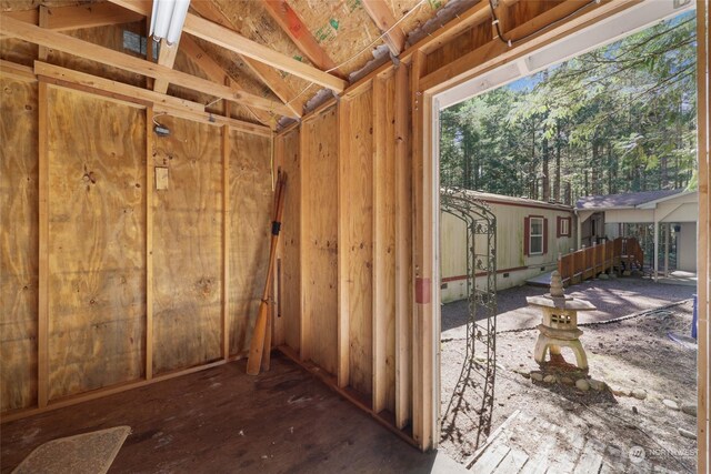 miscellaneous room with lofted ceiling